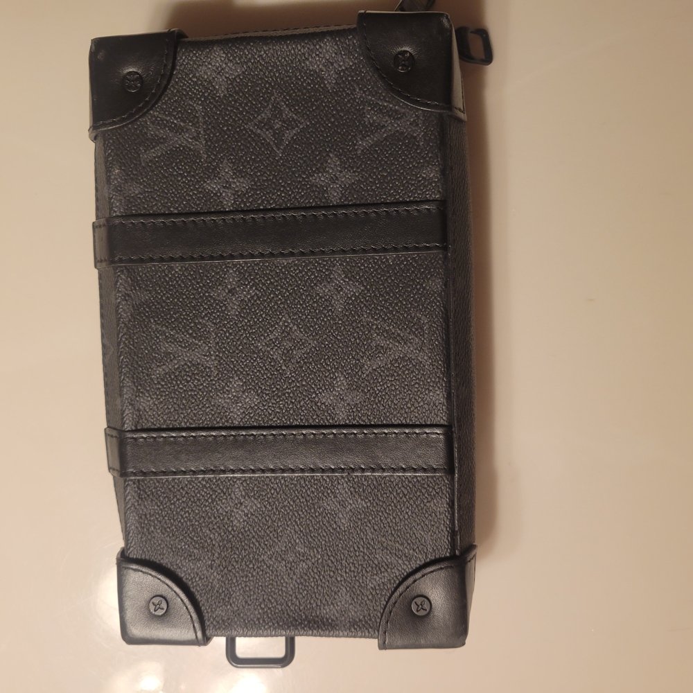Sleek Black Wallet with Monogram Pattern and Structured Design